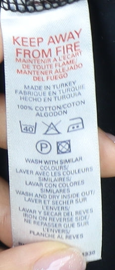 Brand and care label for French Connection girls’ black tank top, size 14, accented logo