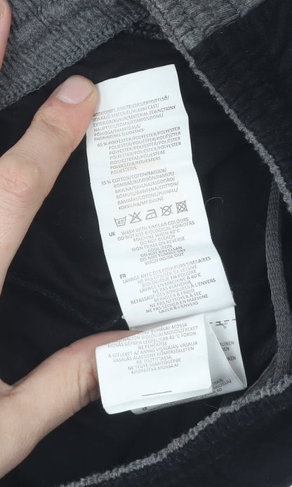 Brand and care label for Slazenger boys’ black track pants 9-10 years