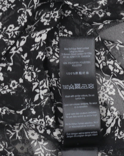 Close-up detail of Miss Selfridge Women's Black Floral Chiffon Blouse, size 8