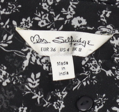 Brand and care label for Miss Selfridge Women's Black Floral Chiffon Blouse, size 8