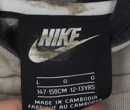 Close-up detail of Nike girls’ beige pullover hoodie l - casual & comfortable