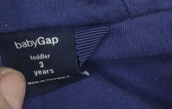 Close-up detail of Gap girls’ blue polka dot hooded rain coat 3 years