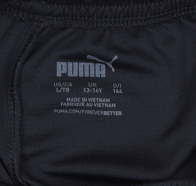 Close-up detail of PUMA boys’ black athletic football shorts 13-14 years