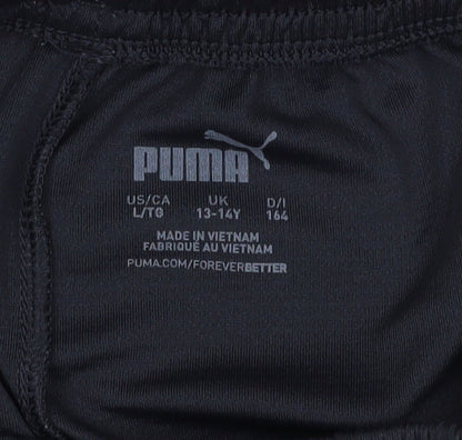 Close-up detail of PUMA boys’ black athletic football shorts 13-14 years