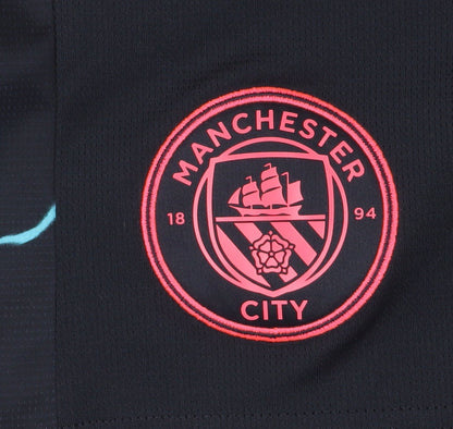 Brand and care label for PUMA boys’ black athletic football shorts 13-14 years
