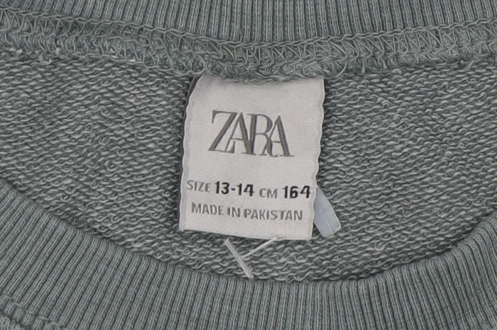 Close-up detail of Zara boys’ green crew neck pullover sweatshirt 13-14 years