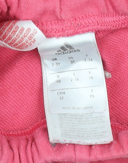 Brand and care label for Adidas girls’ pink jogger trousers, 2-3 years, cotton blend