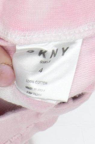 Brand and care label for DKNY girls’ pink tie dye jogger leggings, size 4, years