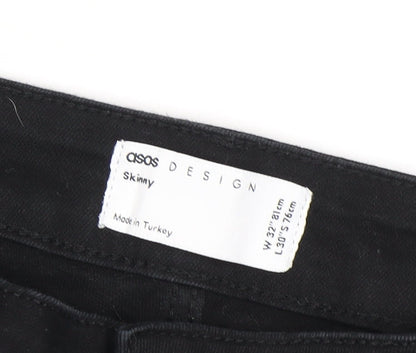 Close-up detail of ASOS men’s black skinny jeans, size 32, regular