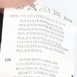 Brand and care label for Sondico boys’ black athletic shorts 13y relaxed fit