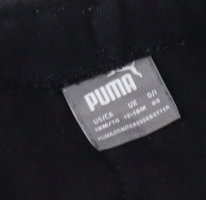 Brand and care label for Puma boys’ black jogger trousers s - activewear cotton blend
