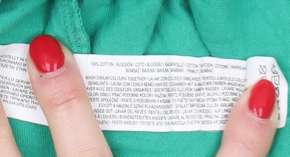Close-up detail of boys’ green simpsons bart t-shirt 12-13 years
