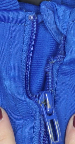 Close-up detail of Adidas boys’ blue track jacket 3-4 years full zip