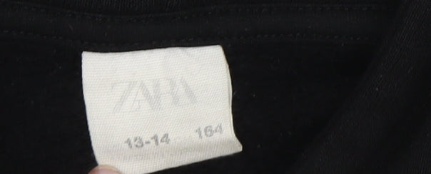 Close-up detail of Zara boys’ black graphic print pullover hoodie, size 14