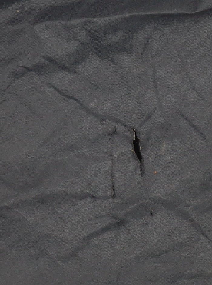 Close-up detail of Trespass boys’ black windbreaker jacket, size 9-10