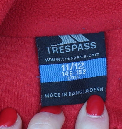 Brand and care label for Trespass boys’ red fleece 1/4 zip sweatshirt 11-12 years