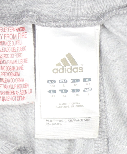 Close-up detail of Adidas girls’ grey athletic shorts 7-8 years