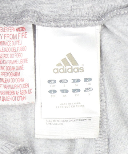 Close-up detail of Adidas girls’ grey athletic shorts 7-8 years