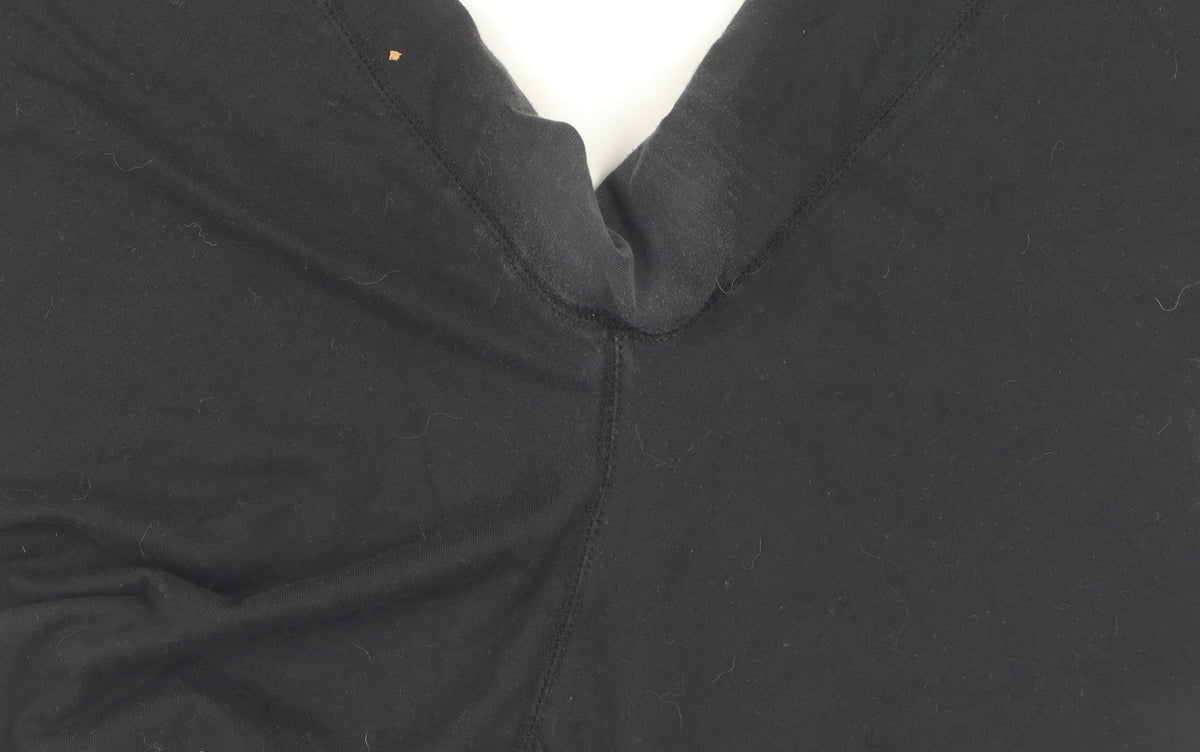 Close-up detail of Puma boys’ black compression shorts m