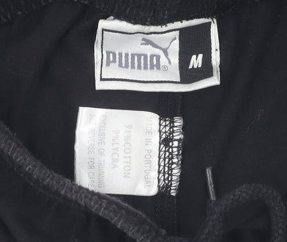 Brand and care label for Puma boys’ black compression shorts m