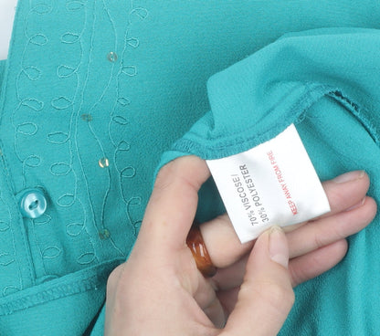 Close-up detail of Style by EWM Women's Green Short Sleeve Blouse