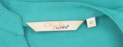 Brand and care label for Style by EWM Women's Green Short Sleeve Blouse