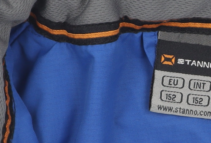 Close-up detail of Stanno boys’ blue school jacket, size 152, with zipped pockets