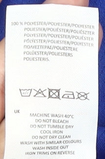 Brand and care label for Sondico boys’ blue football t-shirt age 13 years