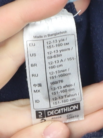 Brand and care label for Quechua boys’ fleece sweatshirt blue 12-13 years 1/4 zip