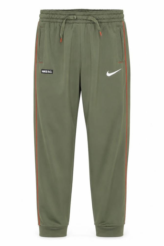Front view of Nike boys’ green track pants m athletic fit