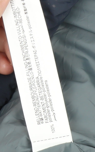 Close-up detail of Zara girls’ blue puffer jacket 8-9 years