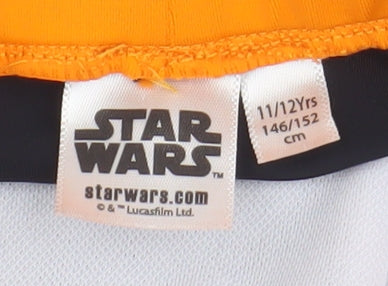 Close-up detail of Star Wars boys’ swim shorts, black/orange, 11-12 years