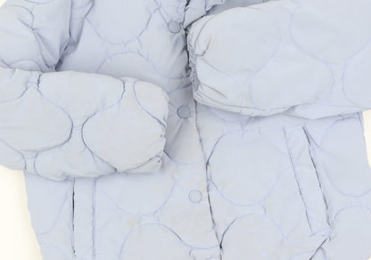 Close-up detail of Zara girls’ blue quilted jacket 8 years lined winter