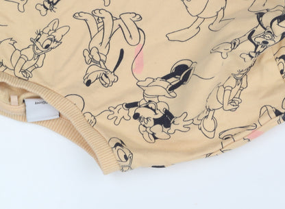 Brand and care label for Next girls’ beige disney graphic sweatshirt, 9 years, pullover