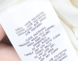 Close-up detail of Lands' End girls’ ivory puffer jacket 10-11 years winter