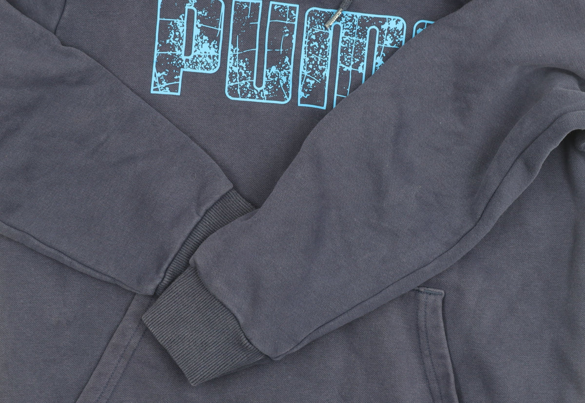 Close-up detail of Puma boys’ blue pullover hoodie in, size S, with logo