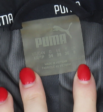 Close-up detail of Puma Women's Black Windbreaker Jacket, size 10