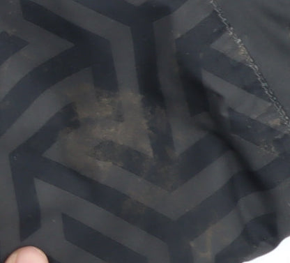 Close-up detail of Trespass boys’ black puffer jacket 7-8 years waterproof