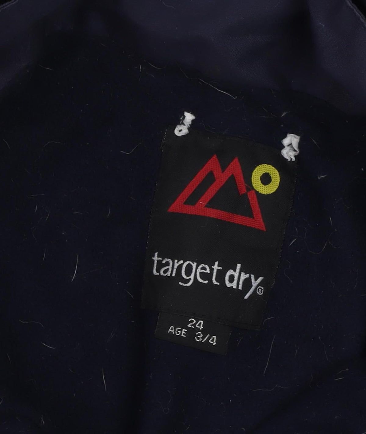 Close-up detail of Target Dry boys’ blue waterproof hooded rain coat 3-4 years