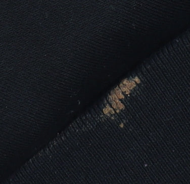 Close-up detail of Fila girls’ black logo pullover hoodie 3xs
