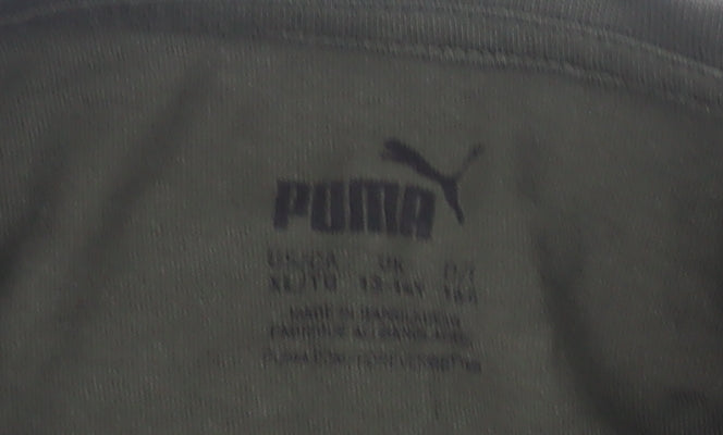 Close-up detail of Puma boys’ green t-shirt, crew neck, logo, size 11-12, years