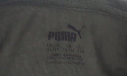 Close-up detail of Puma boys’ green t-shirt, crew neck, logo, size 11-12, years