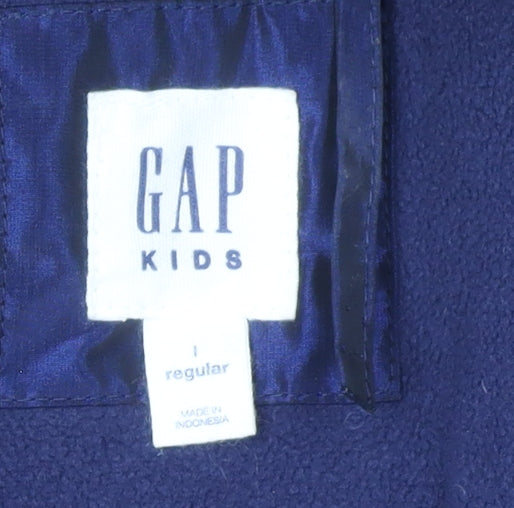 Close-up detail of Gap girls’ blue puffer jacket 11 years winter hooded