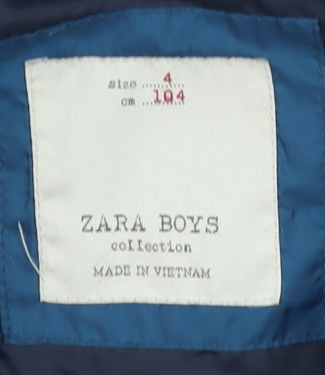 Brand and care label for Zara boys’ blue puffer jacket 4 years hooded sleeveless