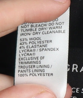 Close-up detail of Autograph Men's Black Tailored Dress Pants, size 34