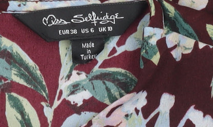 Brand and care label for Miss Selfridge Women's Floral Blouse, size 10