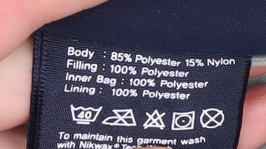 Close-up detail of Puffa girls’ green puffer jacket xl