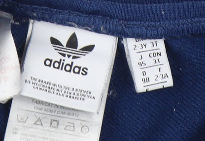 Close-up detail of Adidas boys’ blue track pants 3 years regular fit