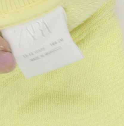 Close-up detail of Zara girls’ yellow pullover sweatshirt 13-14 years