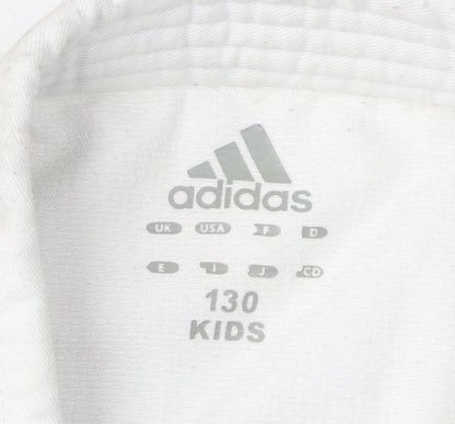 Close-up detail of Adidas boys’ white martial arts jacket 9-10 years